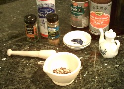 Grinding salt and pepper in a pestle and mortar